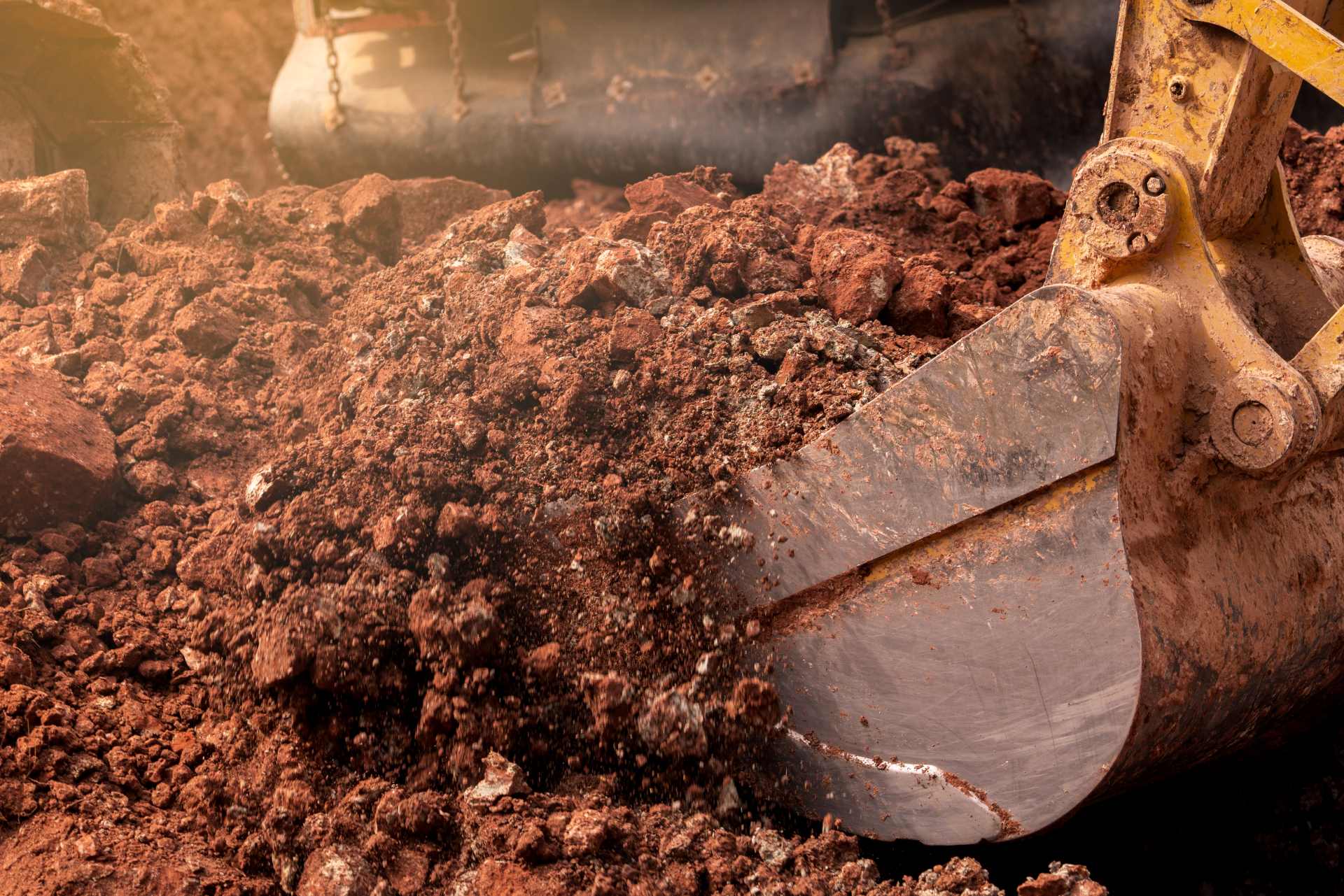 https://www.gumdaledemolition.com.au/wp-content/uploads/closeup-bucket-of-backhoe-digging-soil | Featured image of the What is Soil Remediation? | Gumdale Demolition blog by Gumdale Demolition