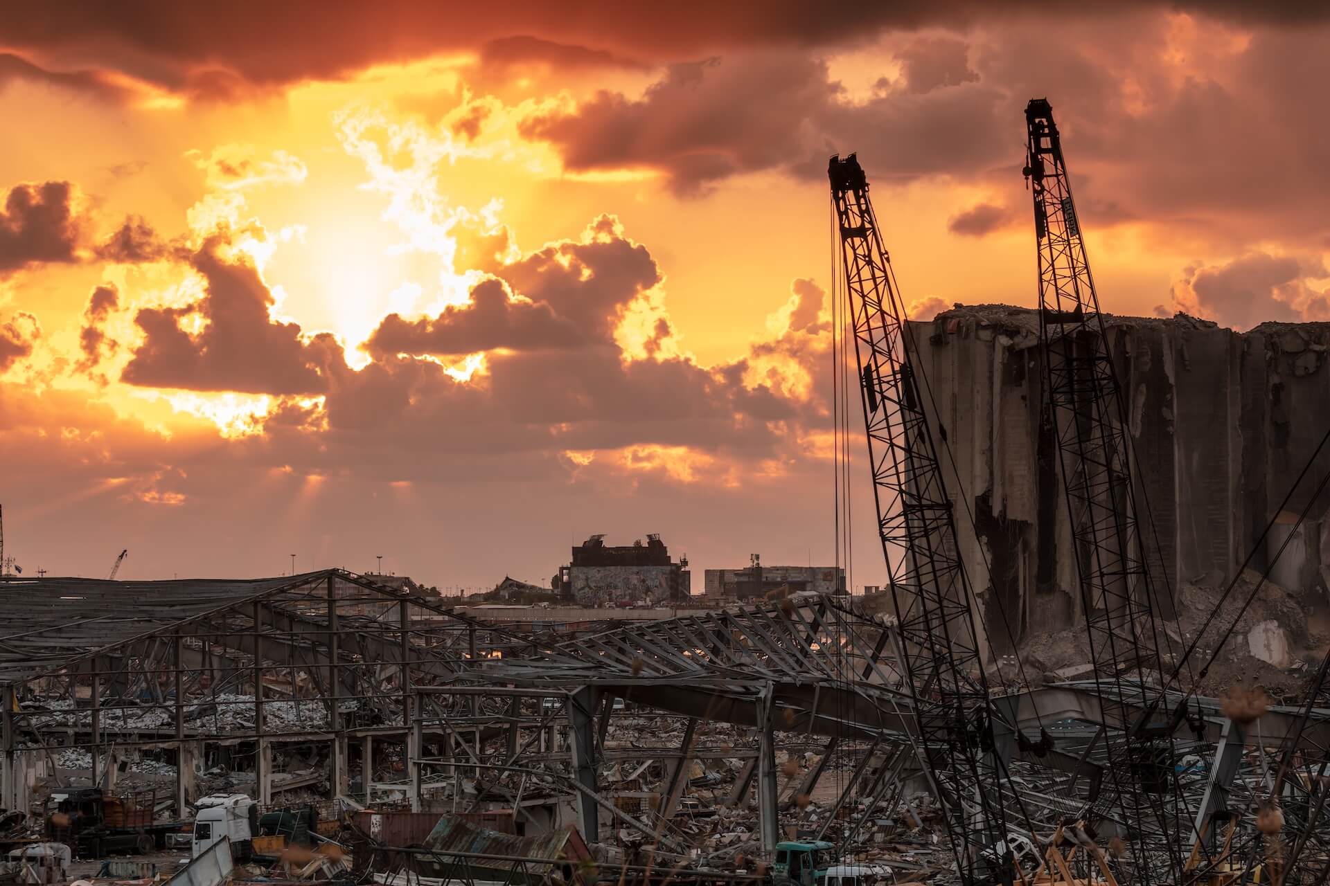 Demolition site with the sun behind a bank of clouds | Featured image of the Sustainable Demolition - What Is It and Why Is It Important blog by Gumdale Demolition.